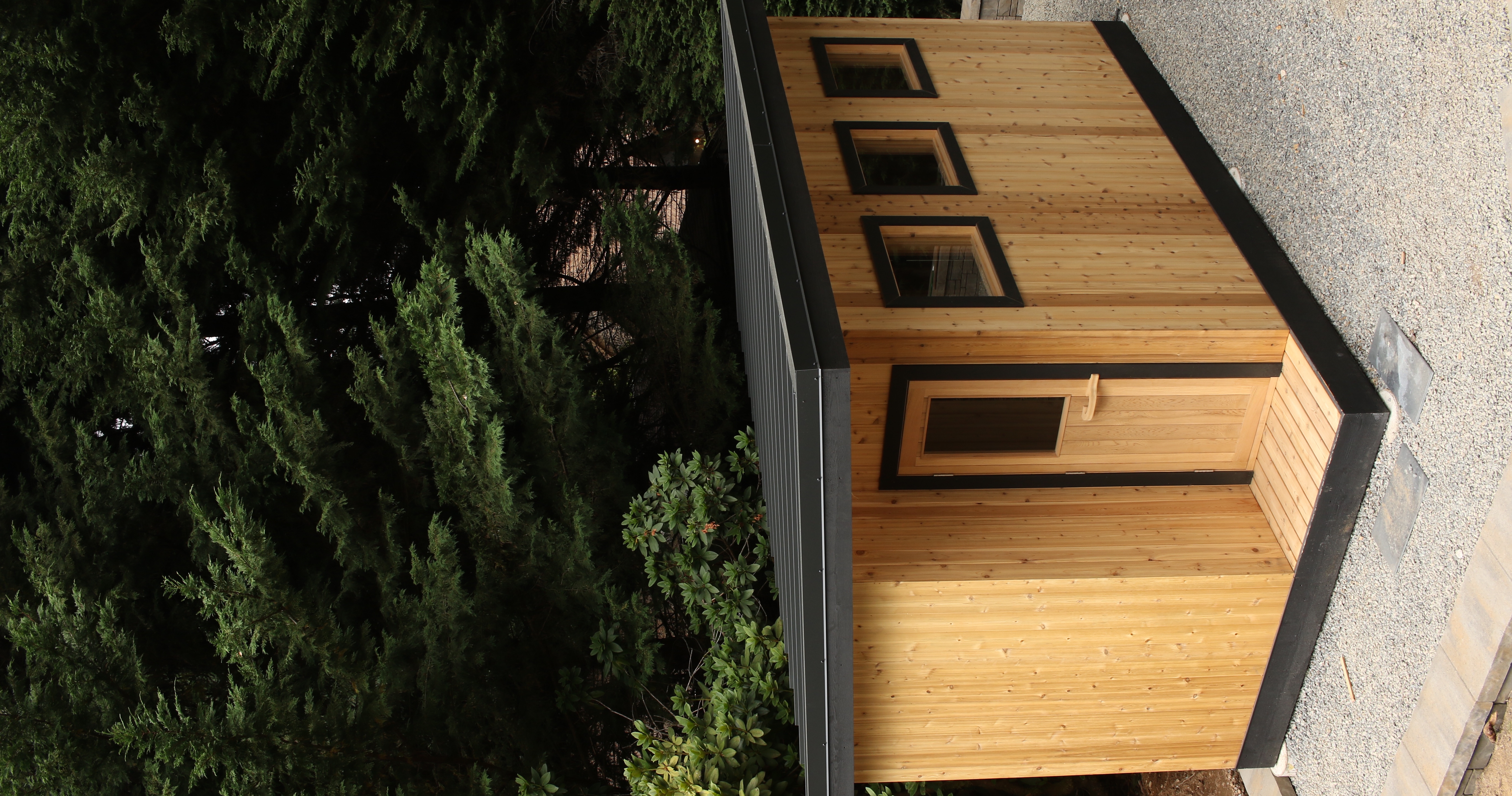 A hand-built SCHÖN sauna in a wooded garden