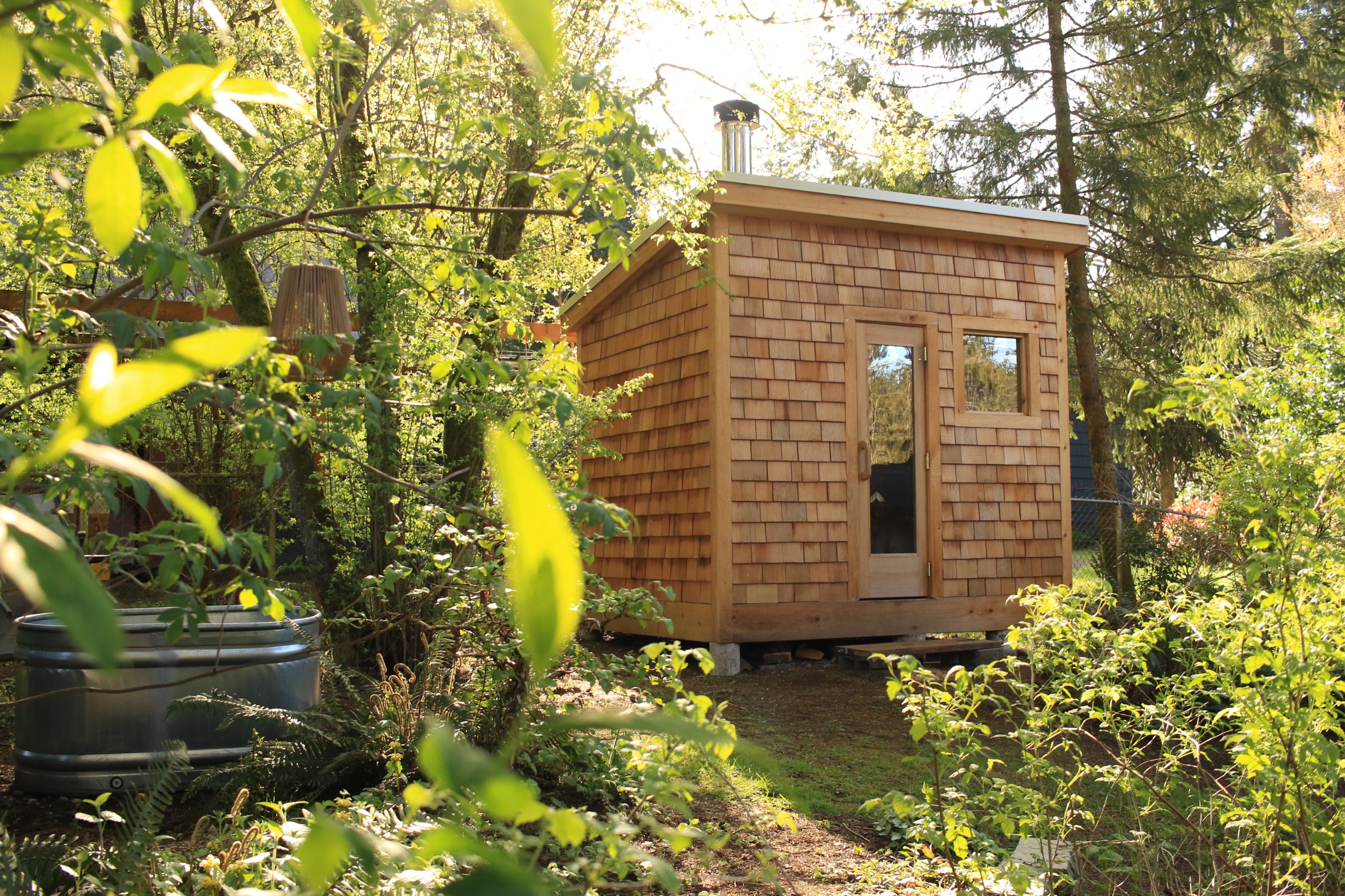 A wood-fired sauna and cold plunge nestled in a Pacific Northwest garden